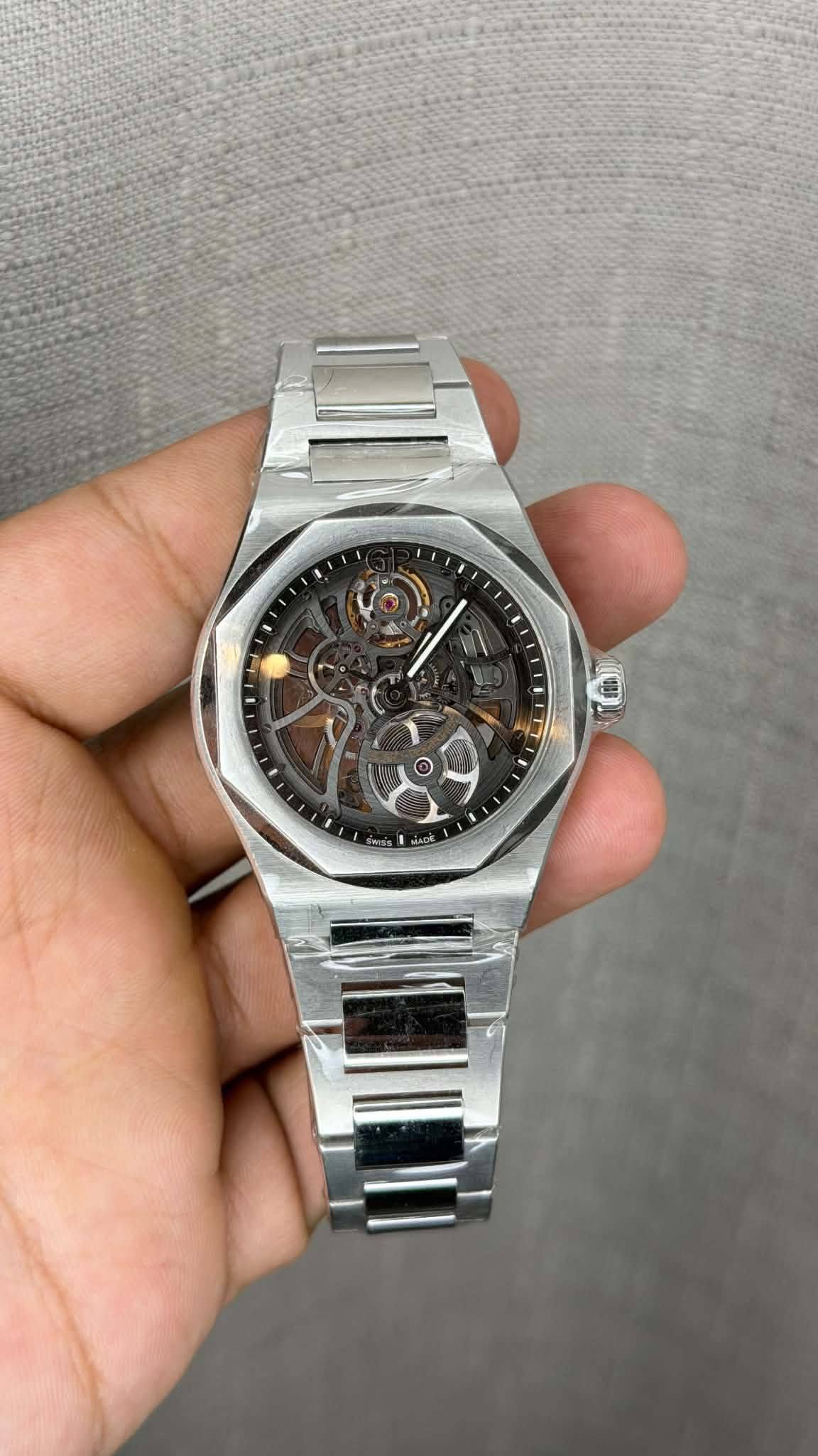 May be an image of wrist watch and text