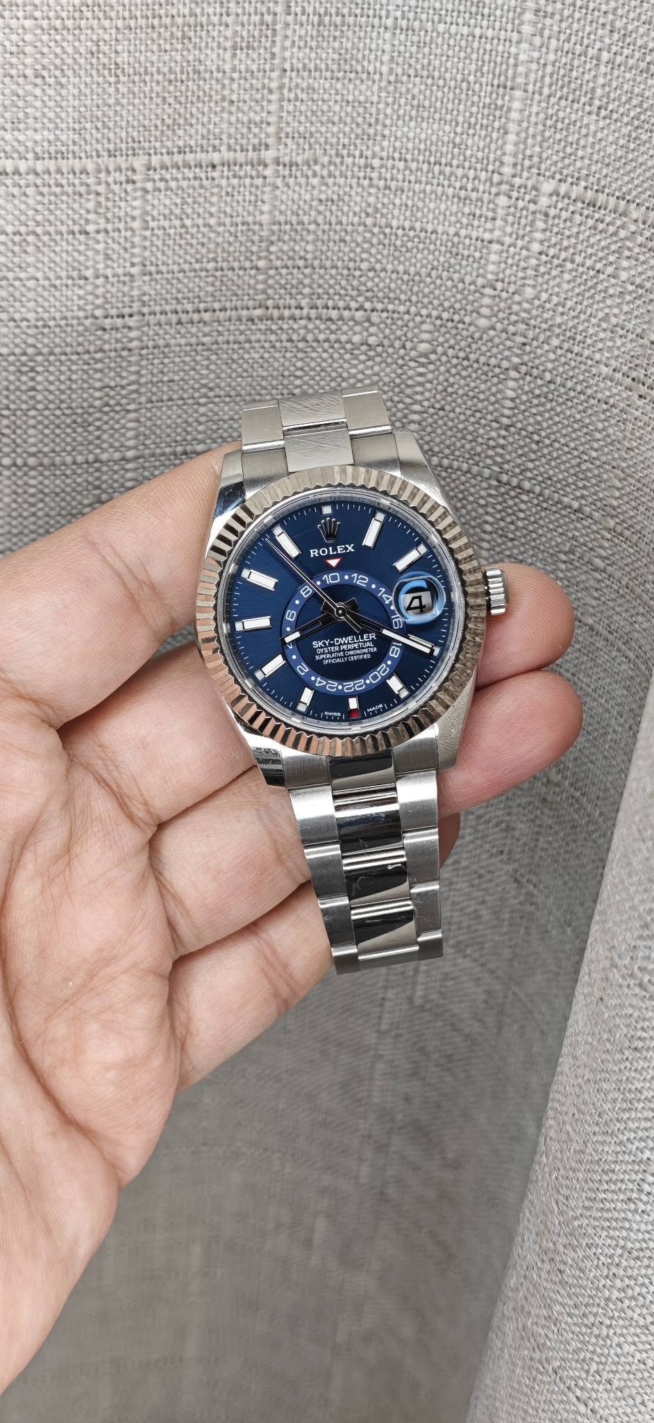 May be an image of wrist watch and text