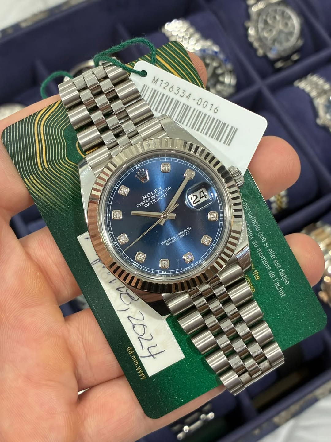 May be an image of wrist watch and text