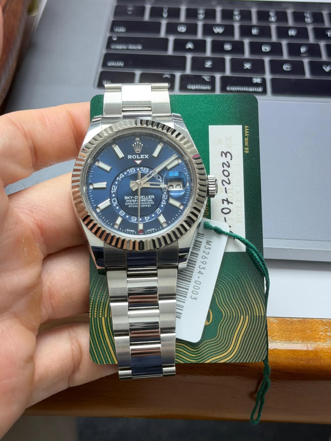 May be an image of wrist watch and text