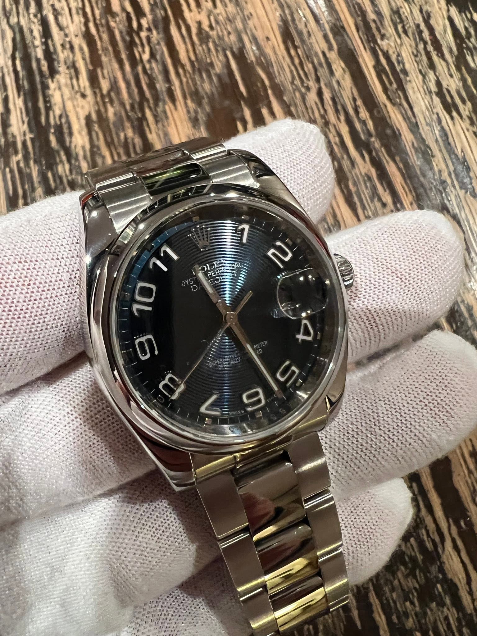May be an image of wrist watch and text