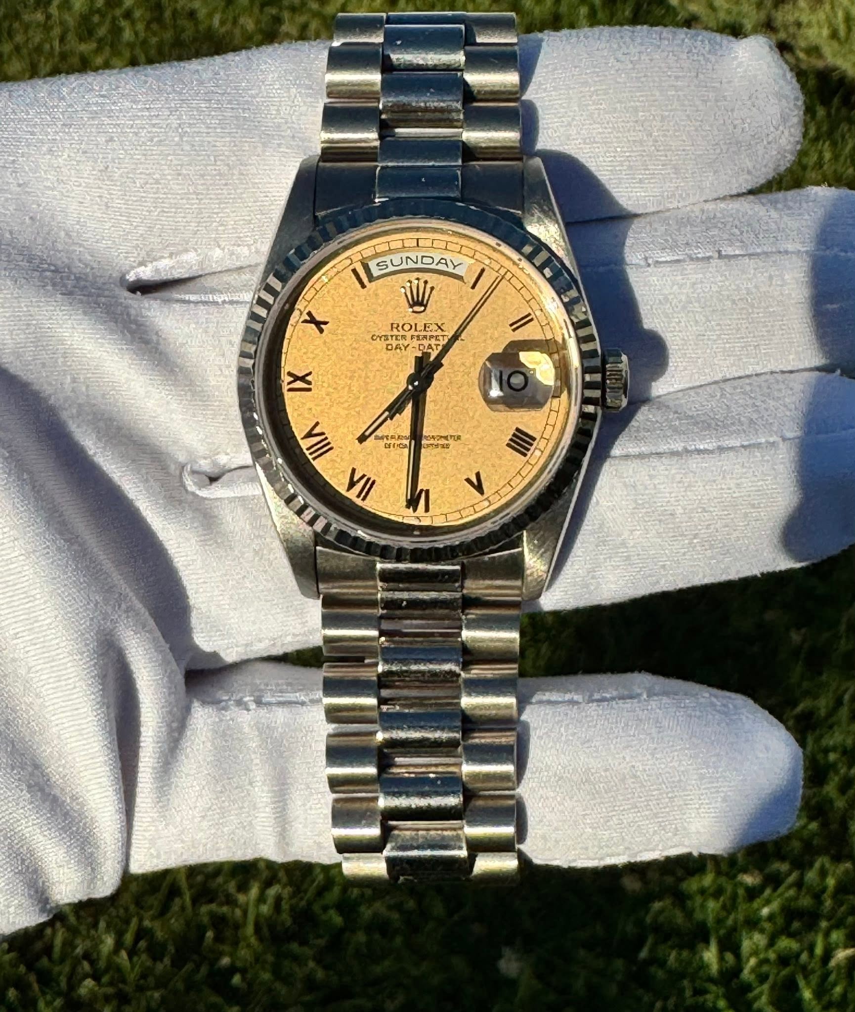 May be an image of wrist watch and text
