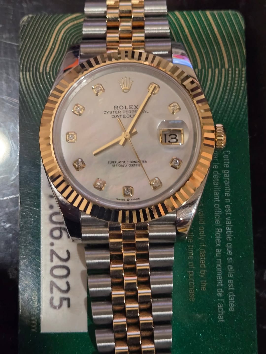 May be an image of wrist watch and text