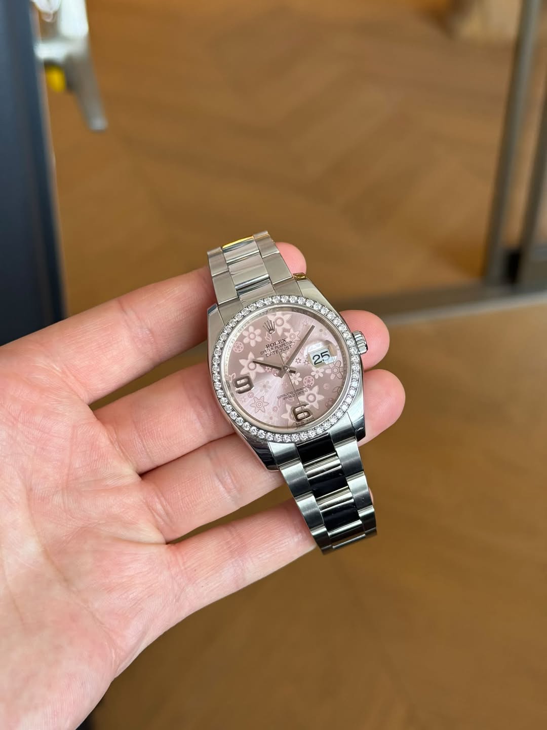 May be an image of wrist watch and text