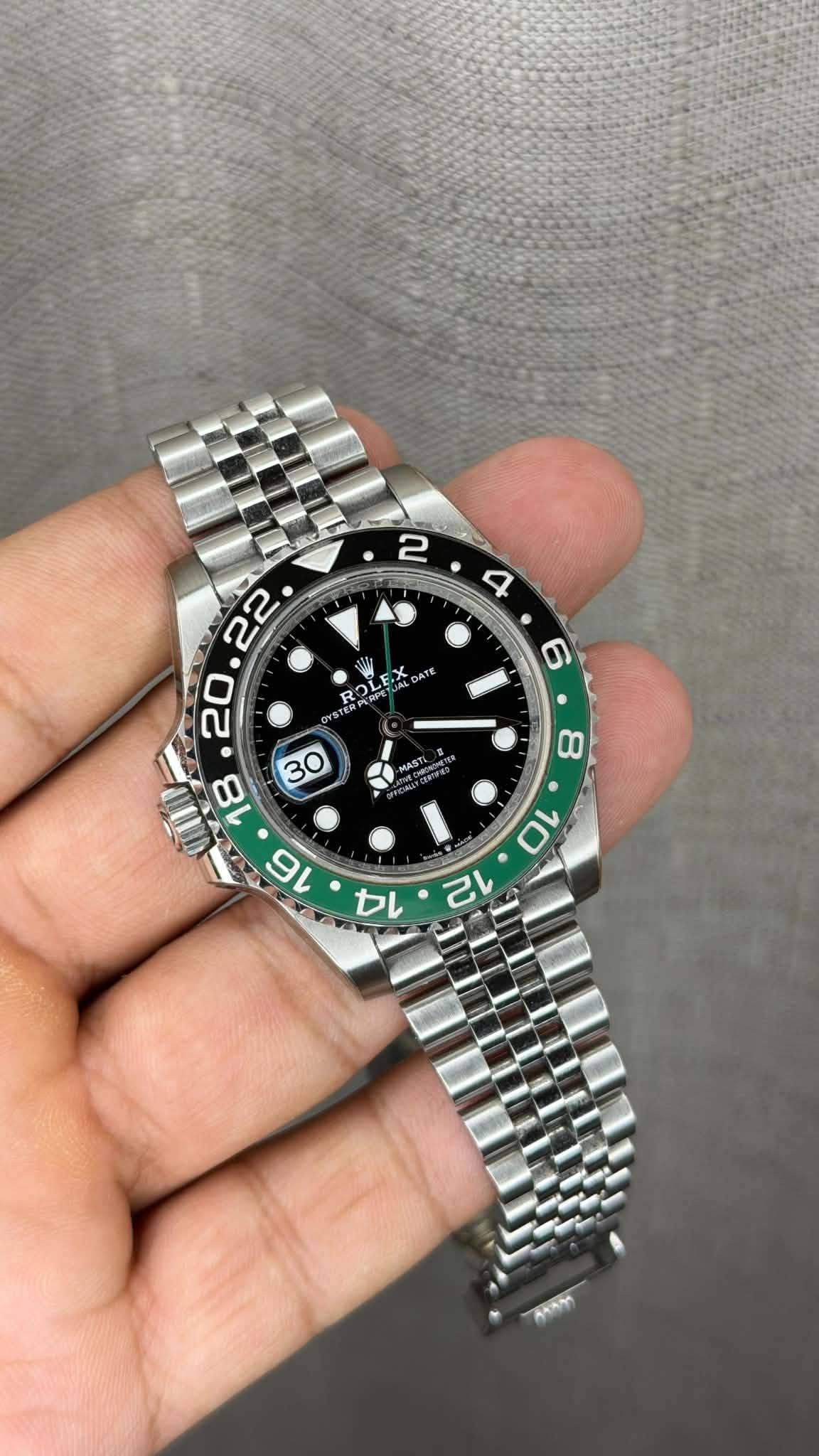 May be an image of wrist watch and text