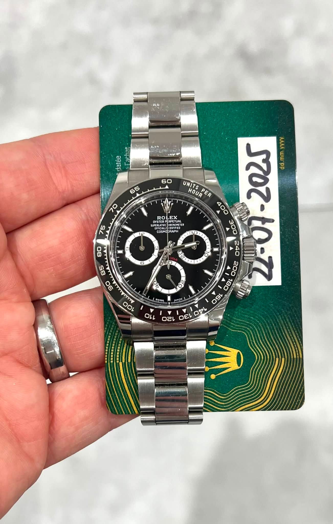 May be an image of wrist watch and text
