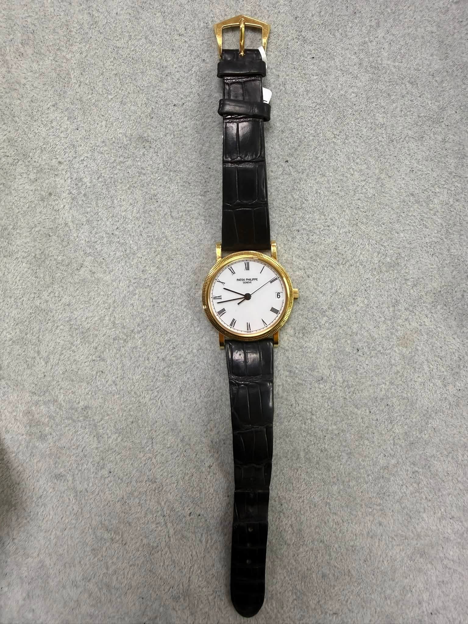 May be an image of leather and wrist watch