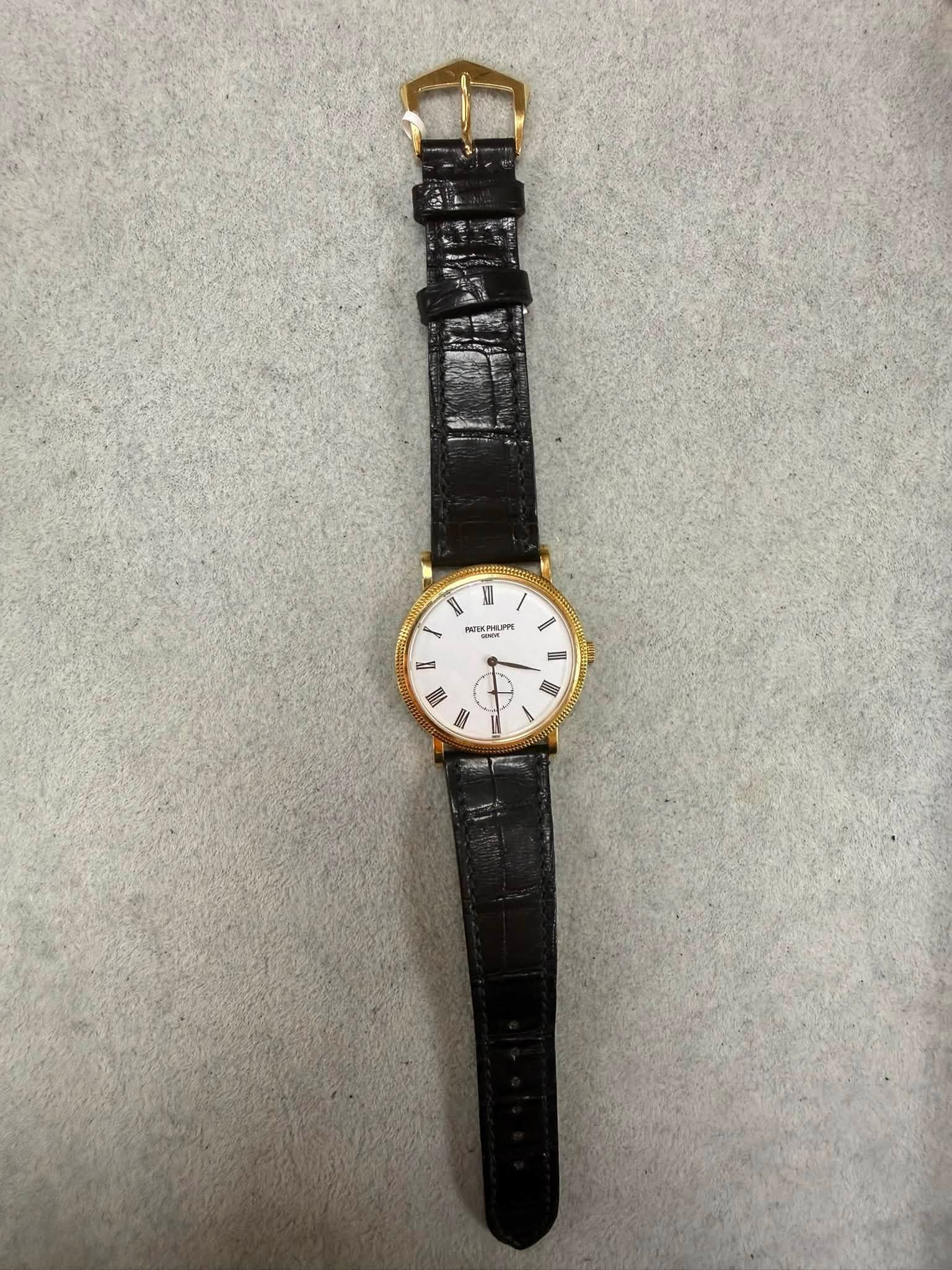 May be an image of leather and wrist watch