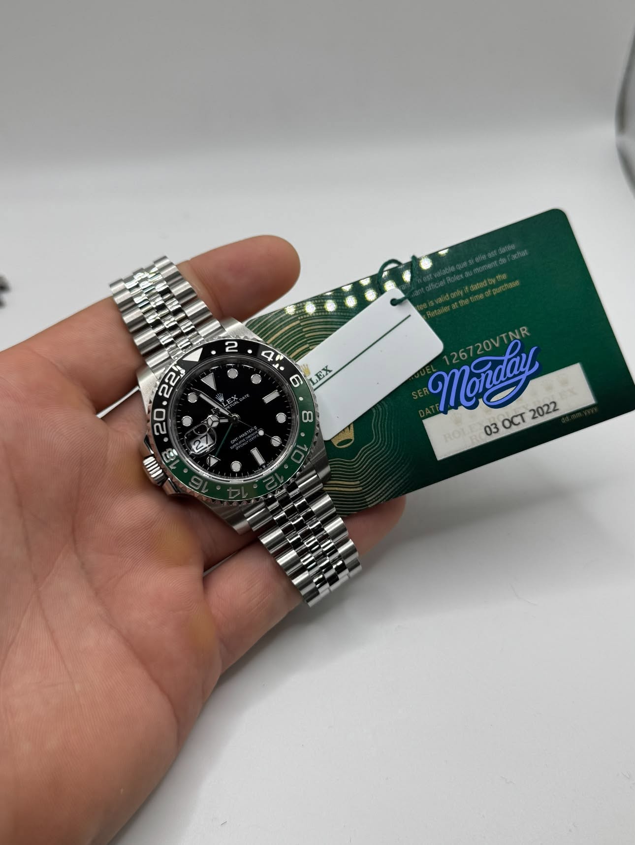 May be an image of wrist watch and text that says '4 G 9 01 EX . AH Monday 720VT 126720VTNR 030C2022 03 OCT 2022'
