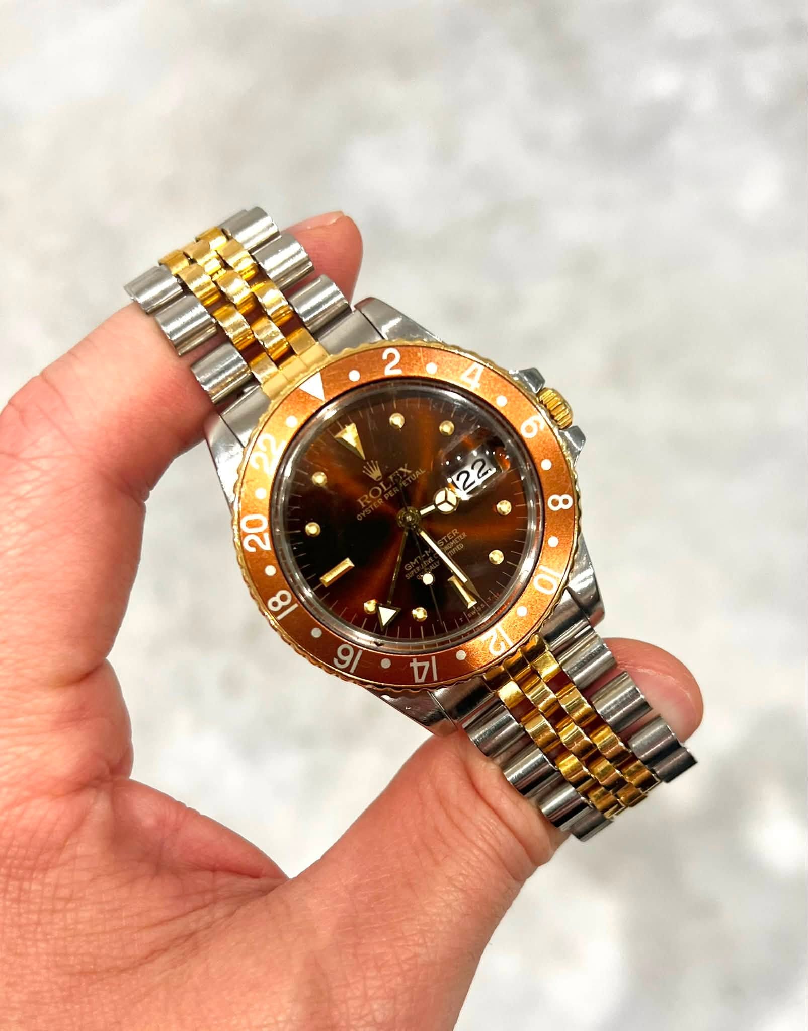 May be an image of wrist watch and text