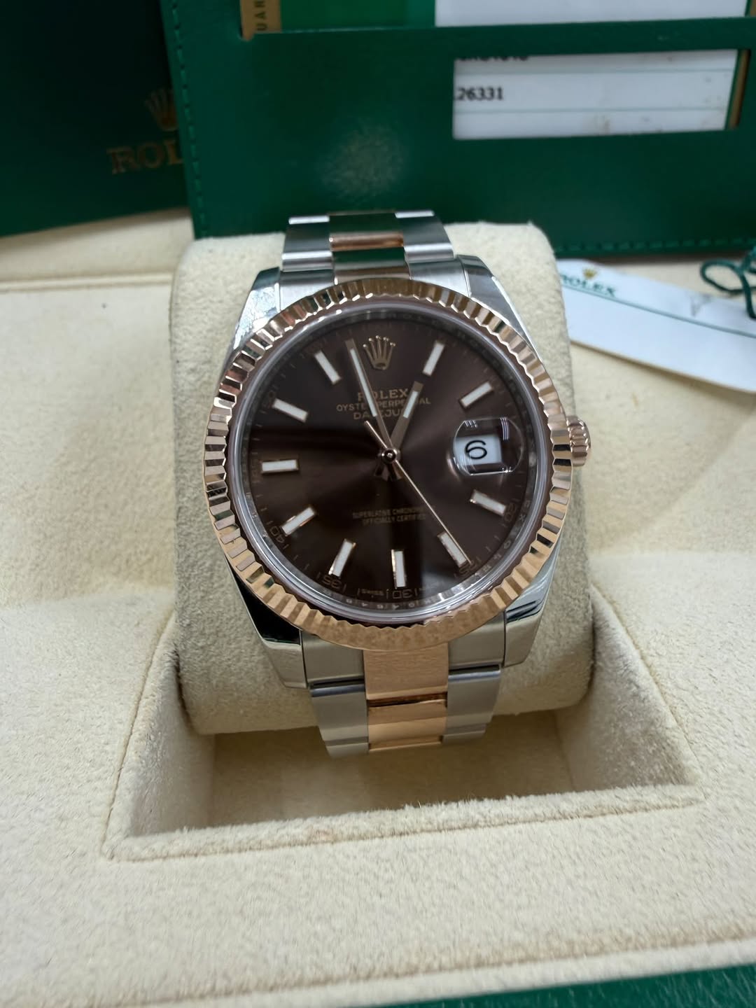 May be an image of wrist watch and text
