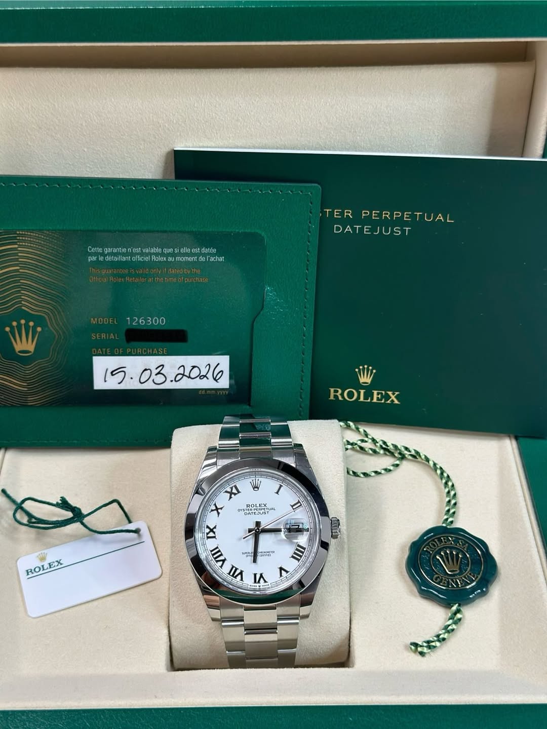May be an image of wrist watch and text