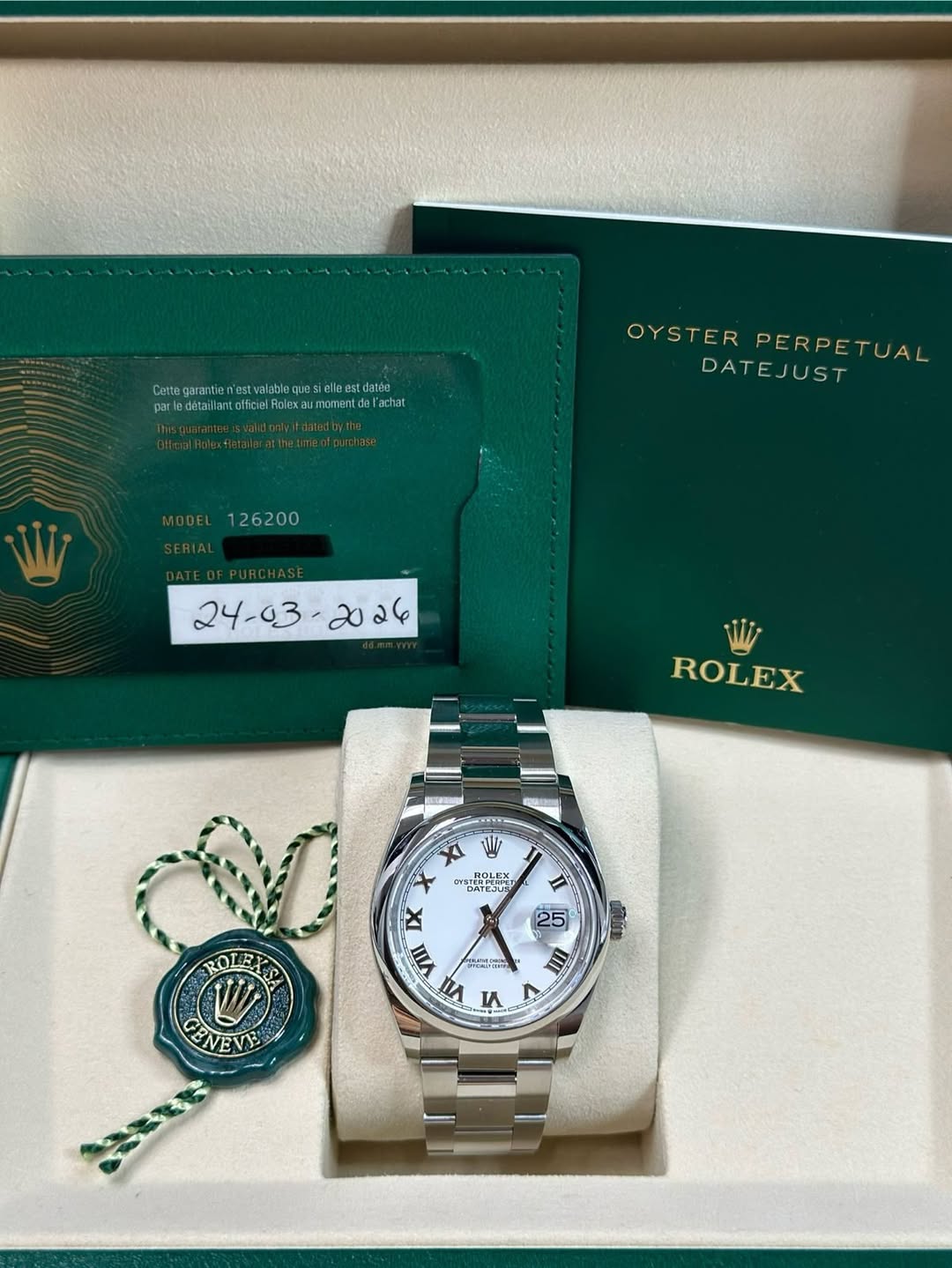 May be an image of wrist watch and text