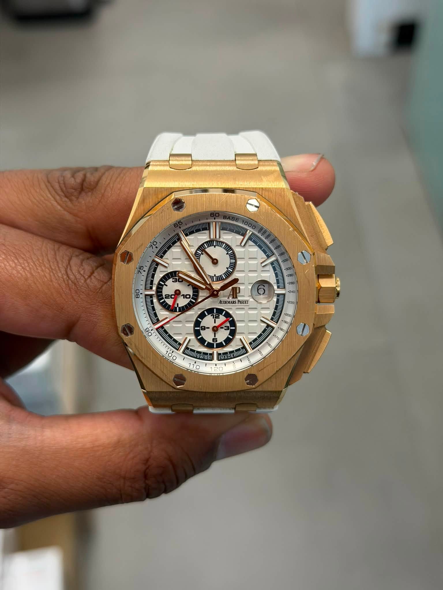 May be an image of wrist watch and text