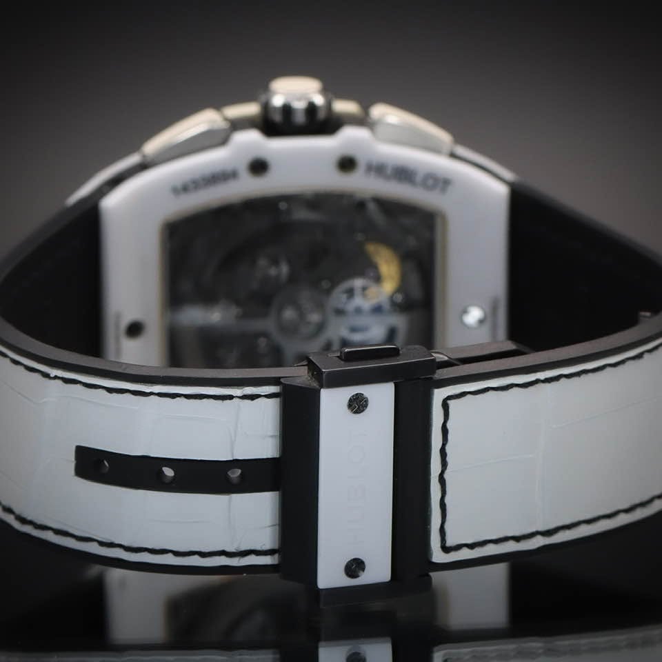 May be an image of wrist watch and text that says 'HUBLOT HUBLOT'
