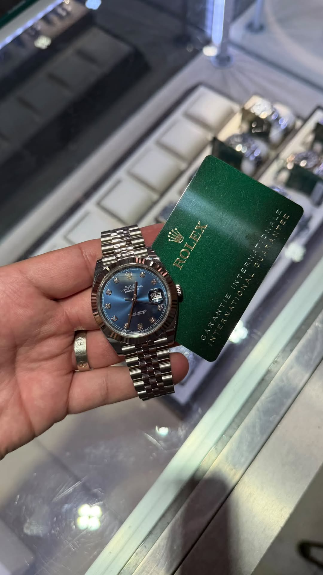 May be an image of wrist watch and text