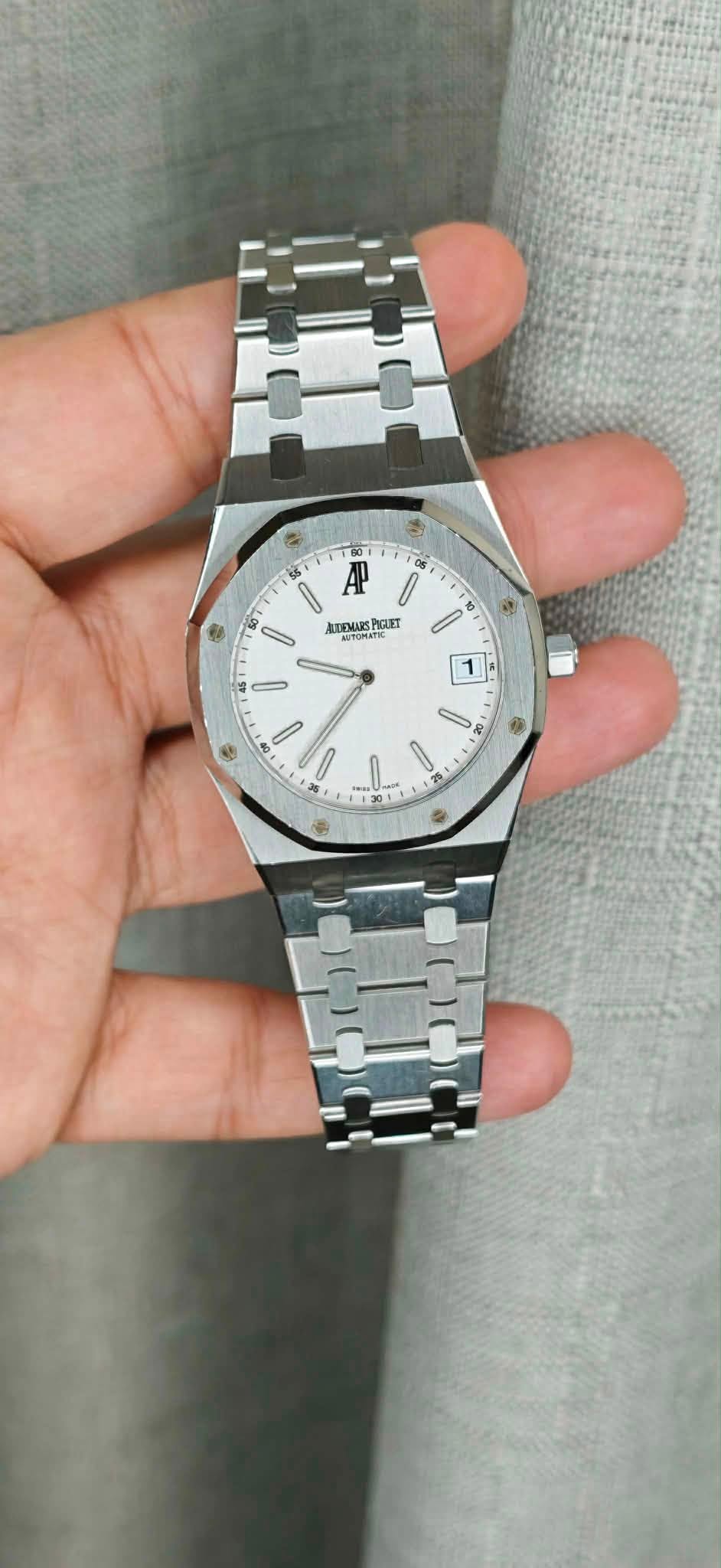 May be an image of wrist watch and text