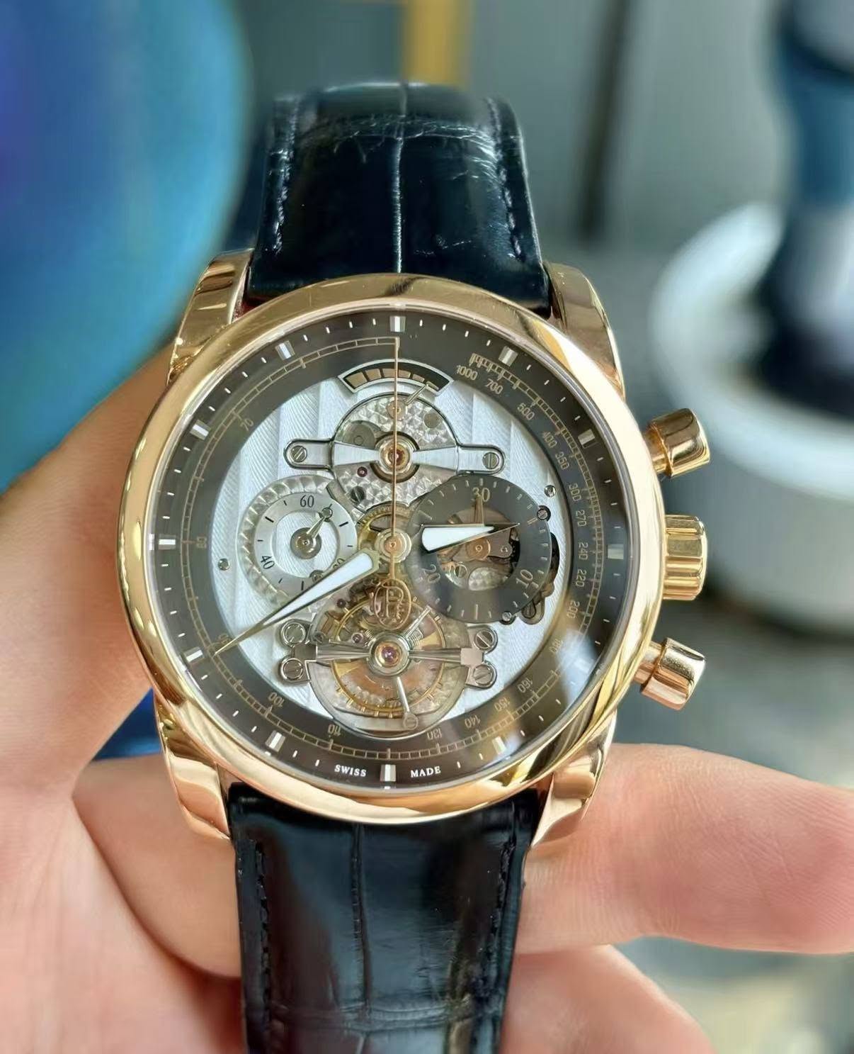 May be an image of wrist watch and text