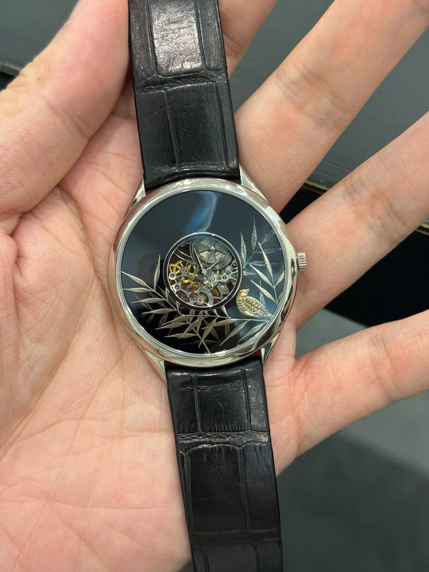 May be an image of wrist watch and text