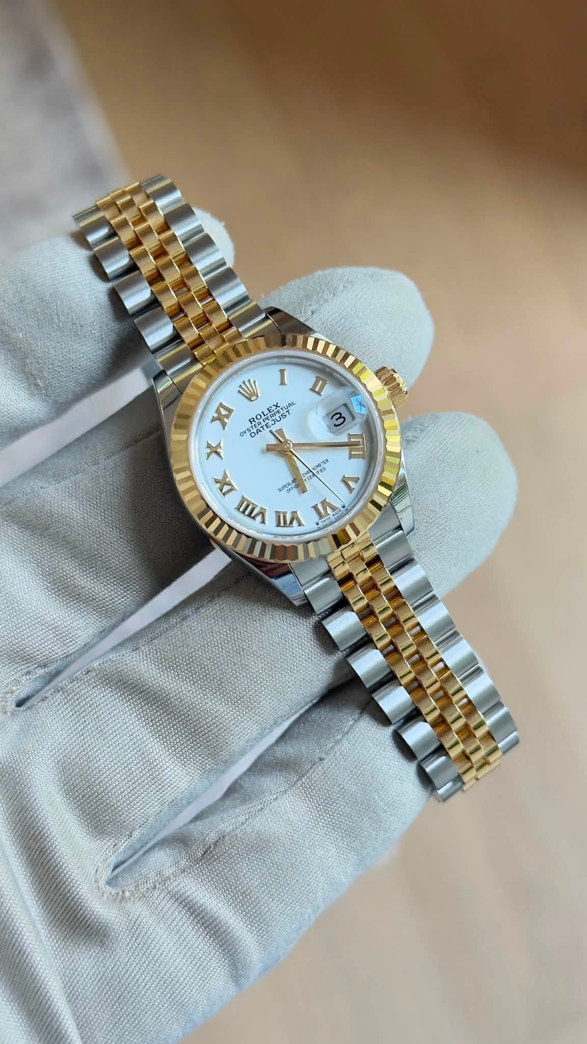 May be an image of wrist watch and text