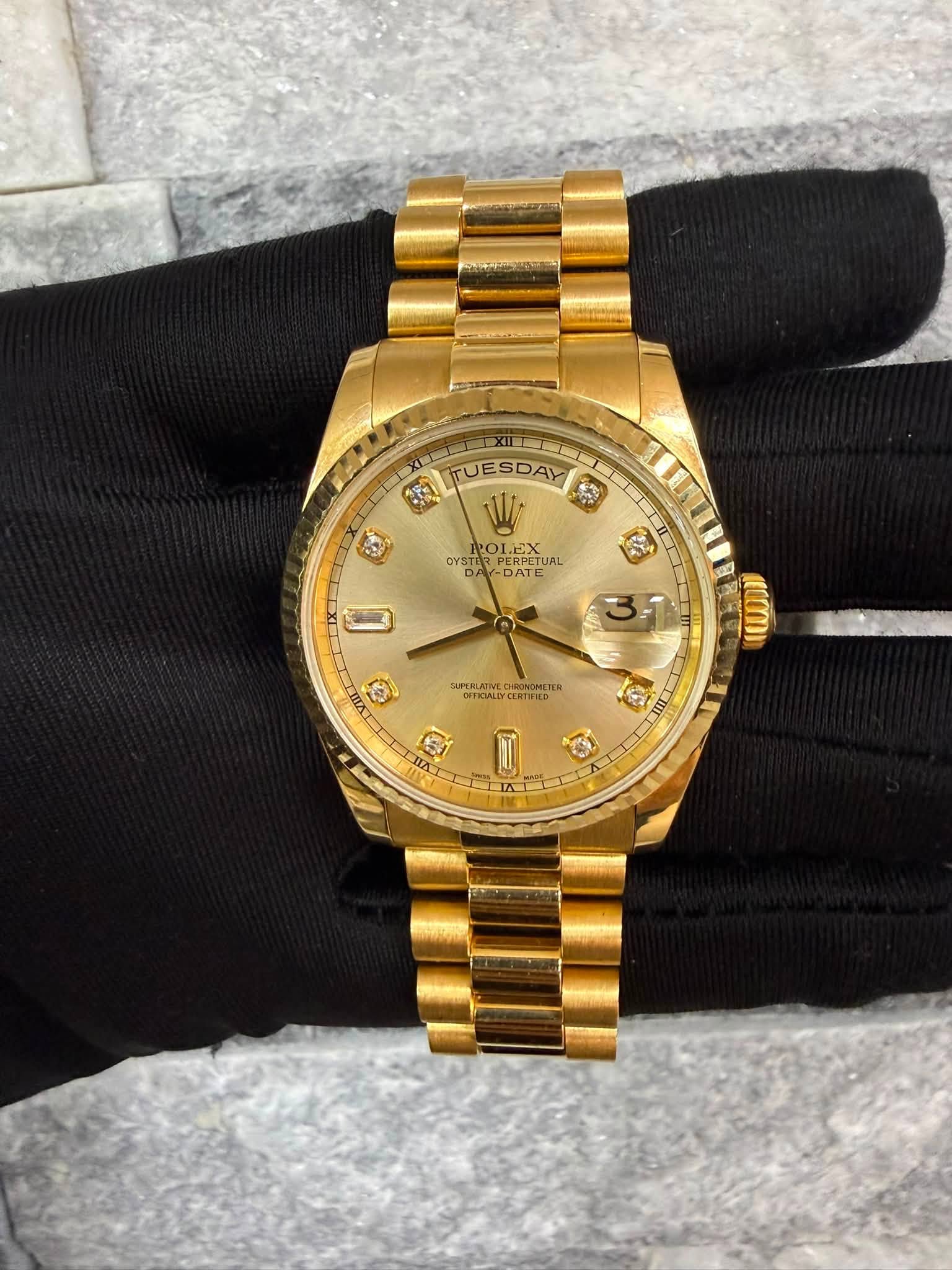May be an image of wrist watch and text