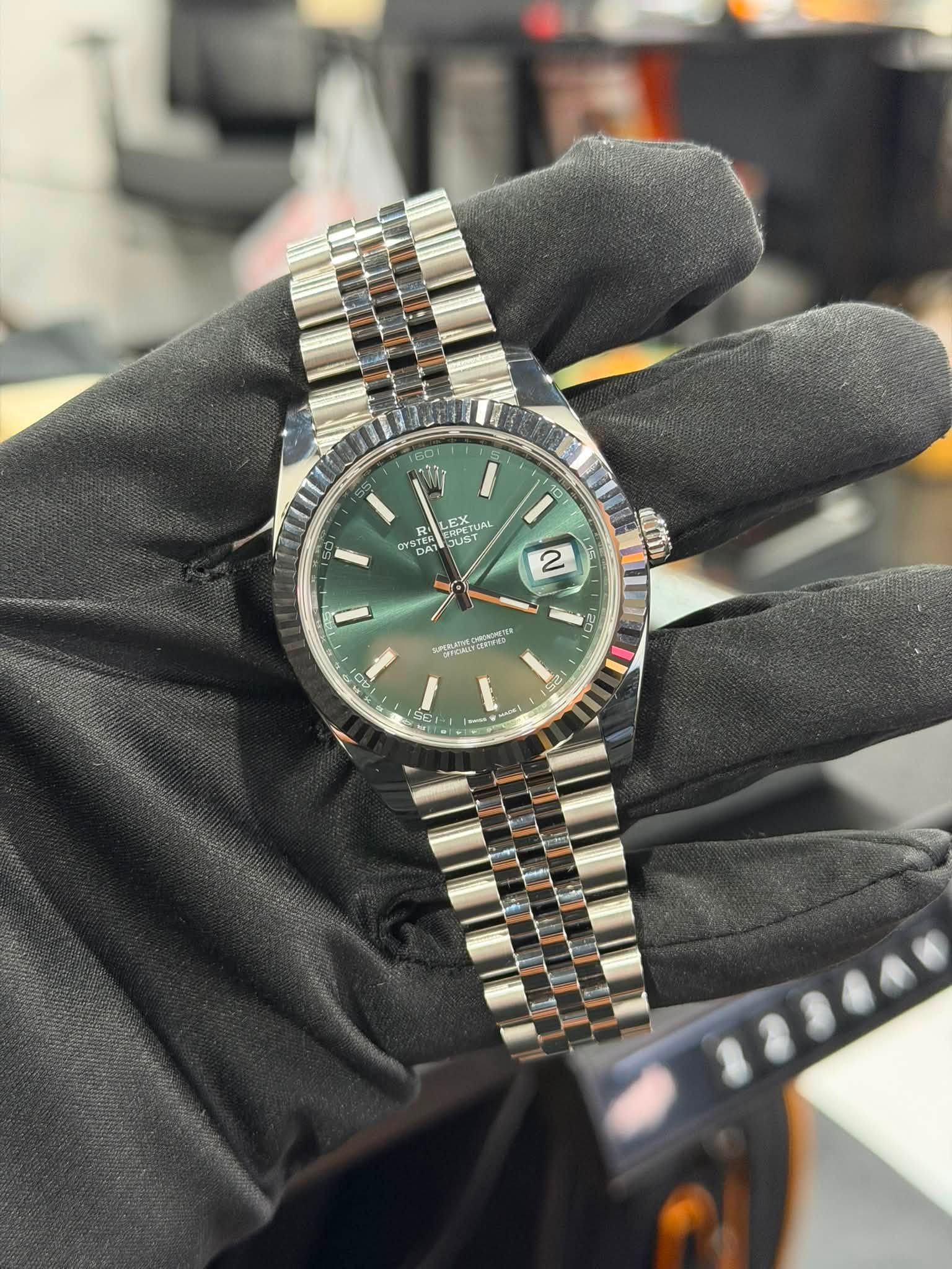 May be an image of wrist watch and text