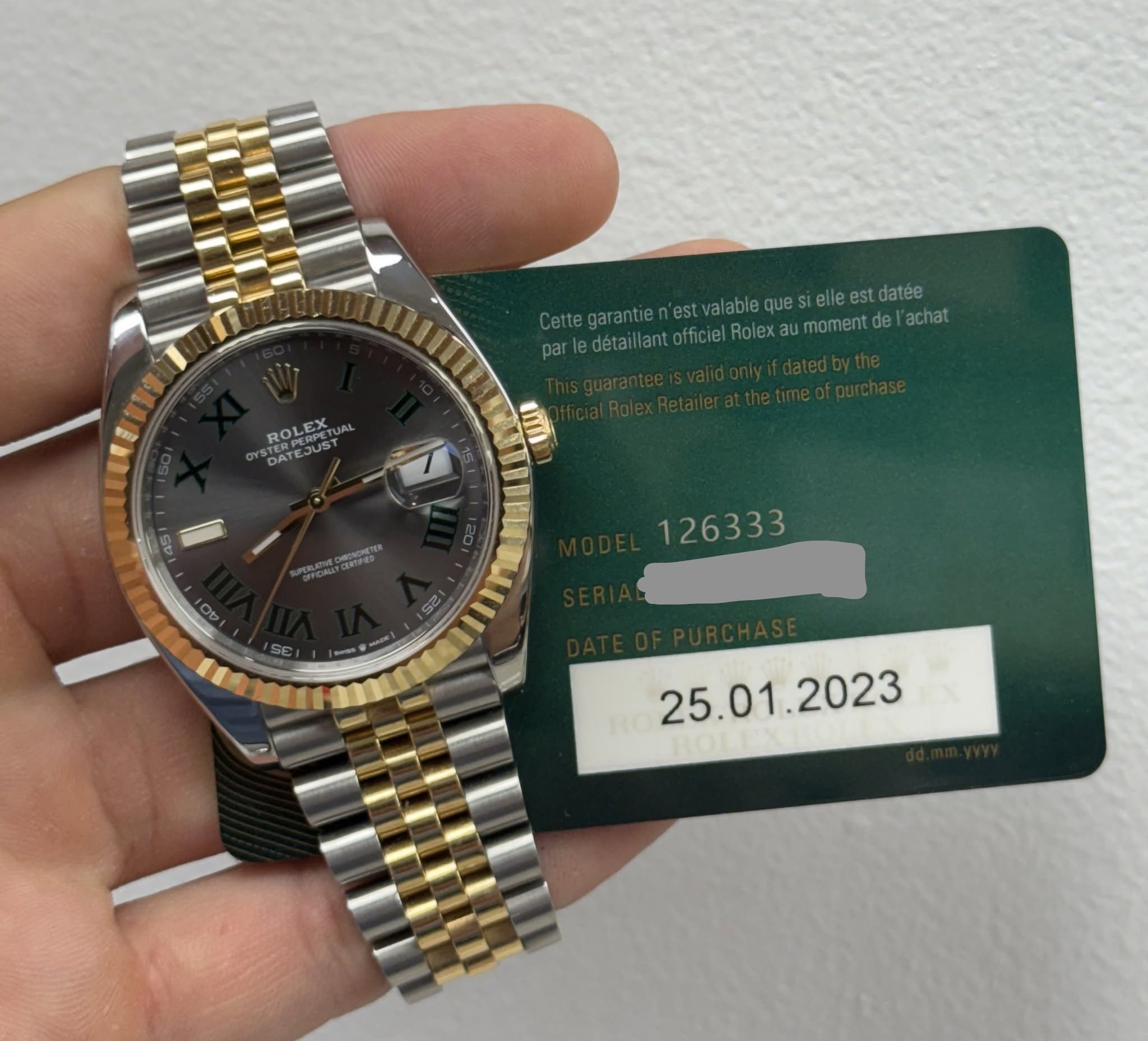 May be an image of wrist watch and text
