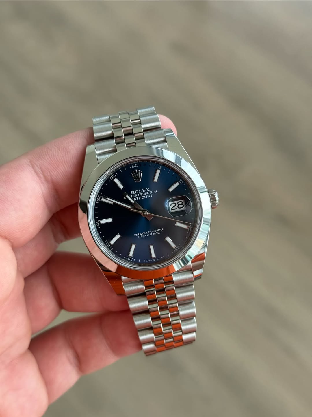 May be an image of wrist watch and text
