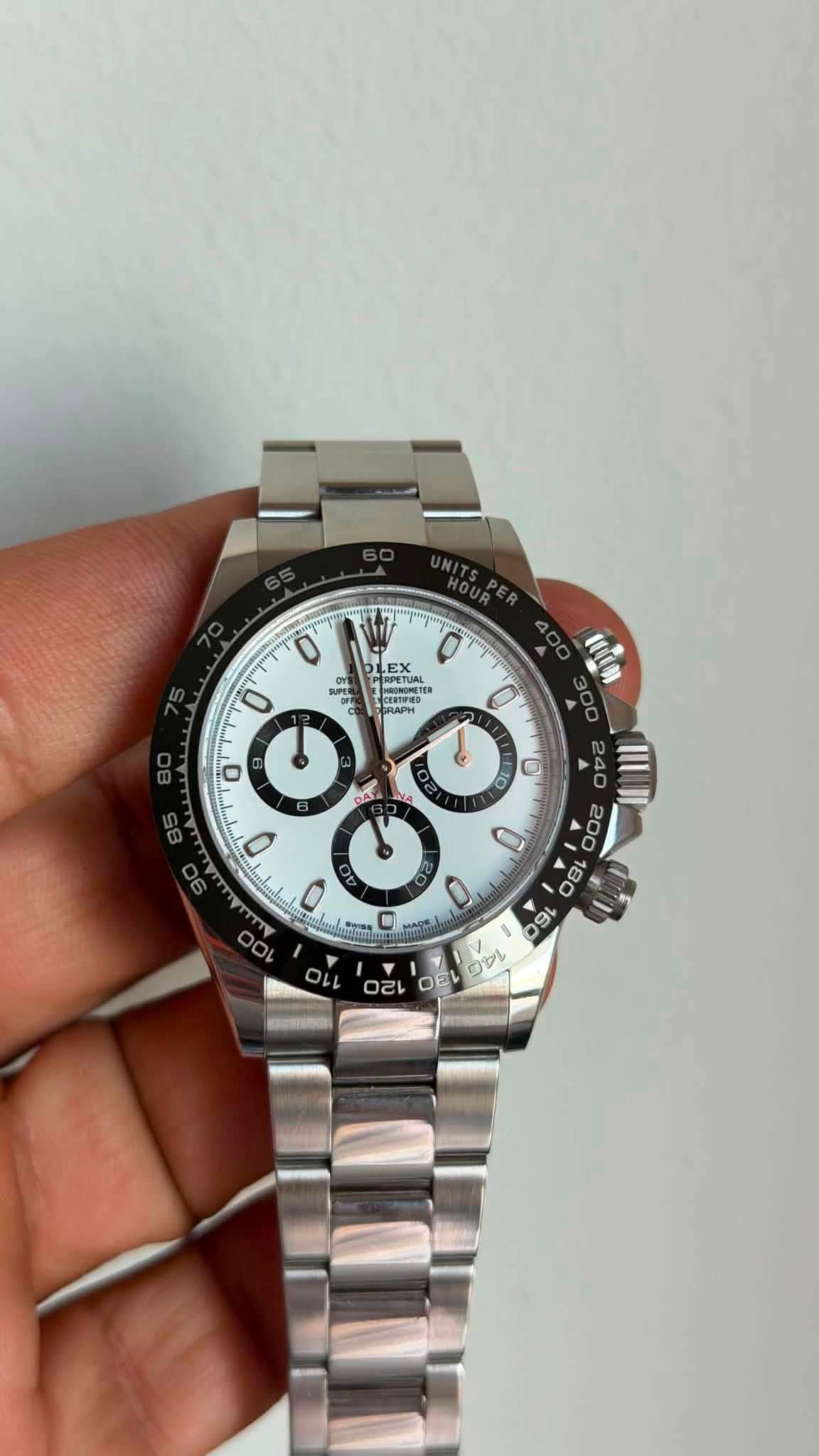 May be an image of wrist watch and text