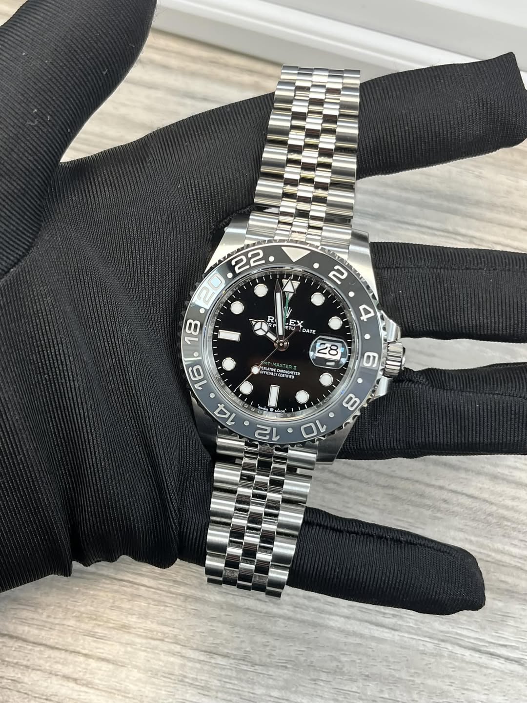 May be an image of wrist watch and text