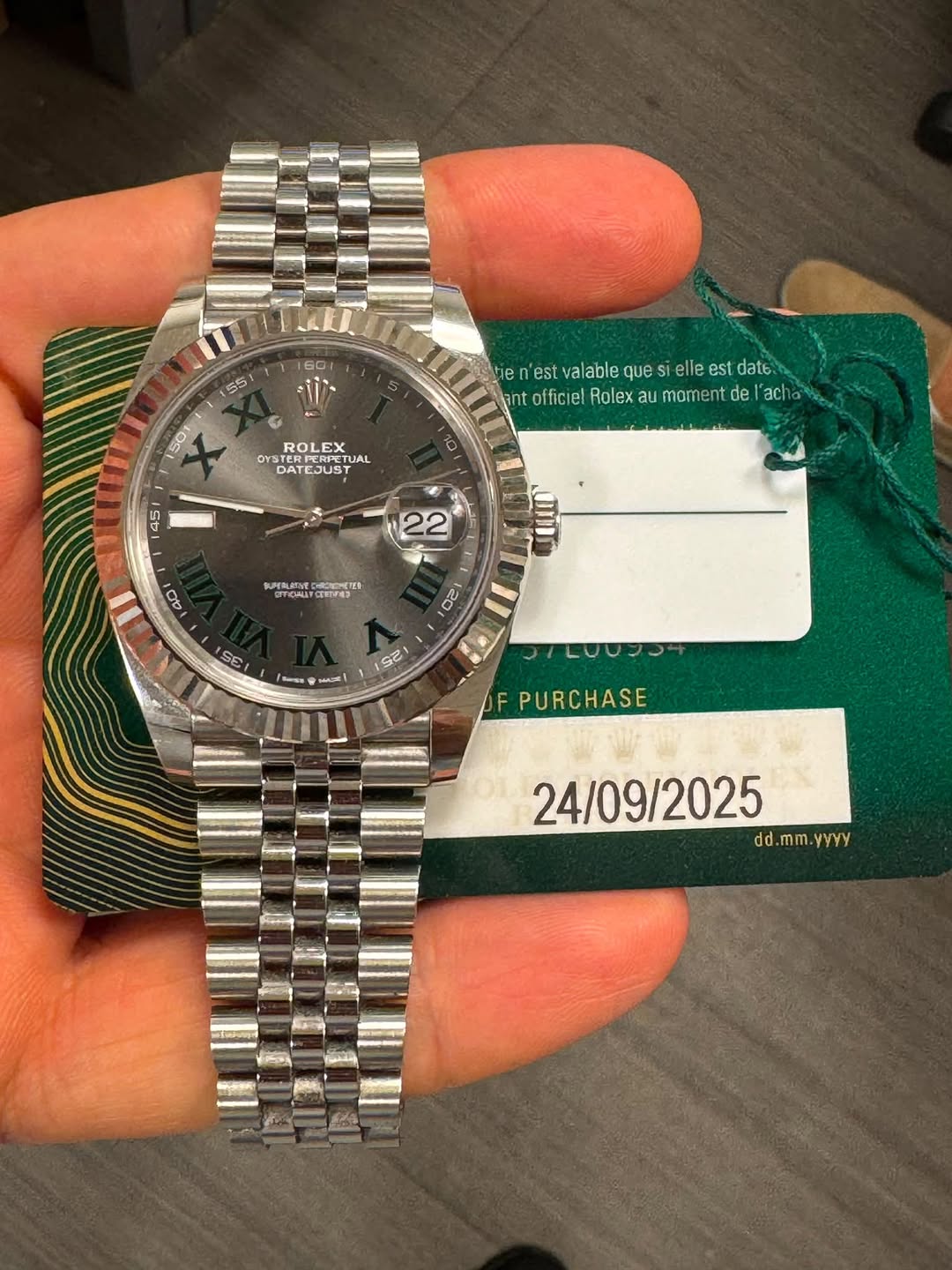 May be an image of wrist watch and text