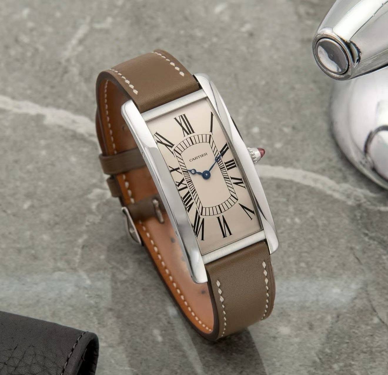 May be an image of leather, digital watch and text