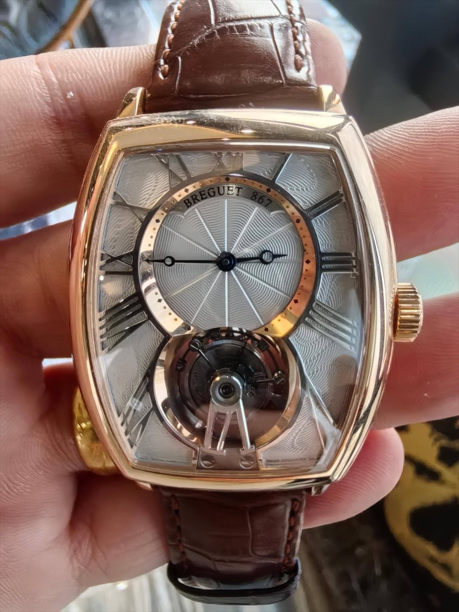 May be an image of wrist watch and text that says 'N'