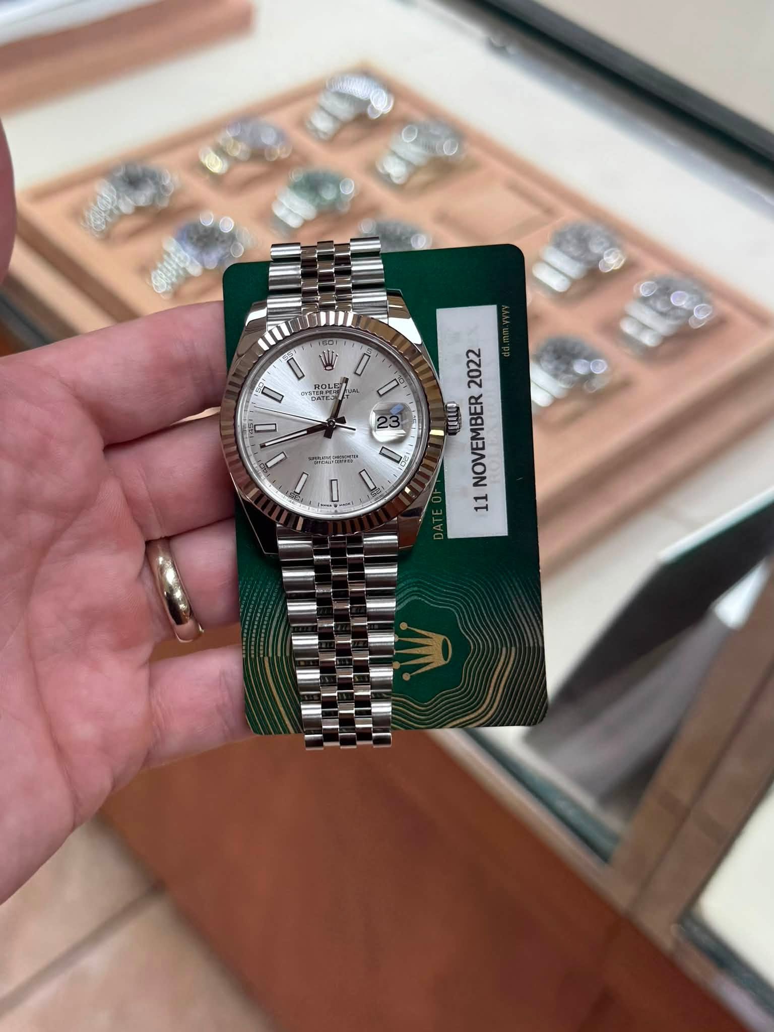 May be an image of wrist watch and text