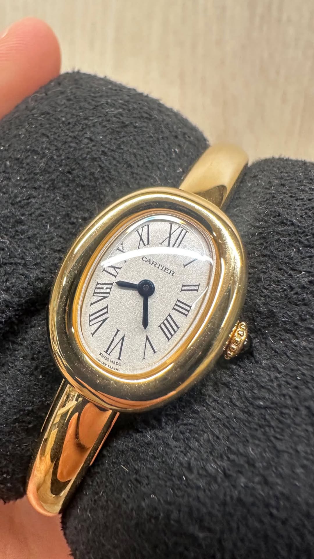 May be an image of wrist watch and text