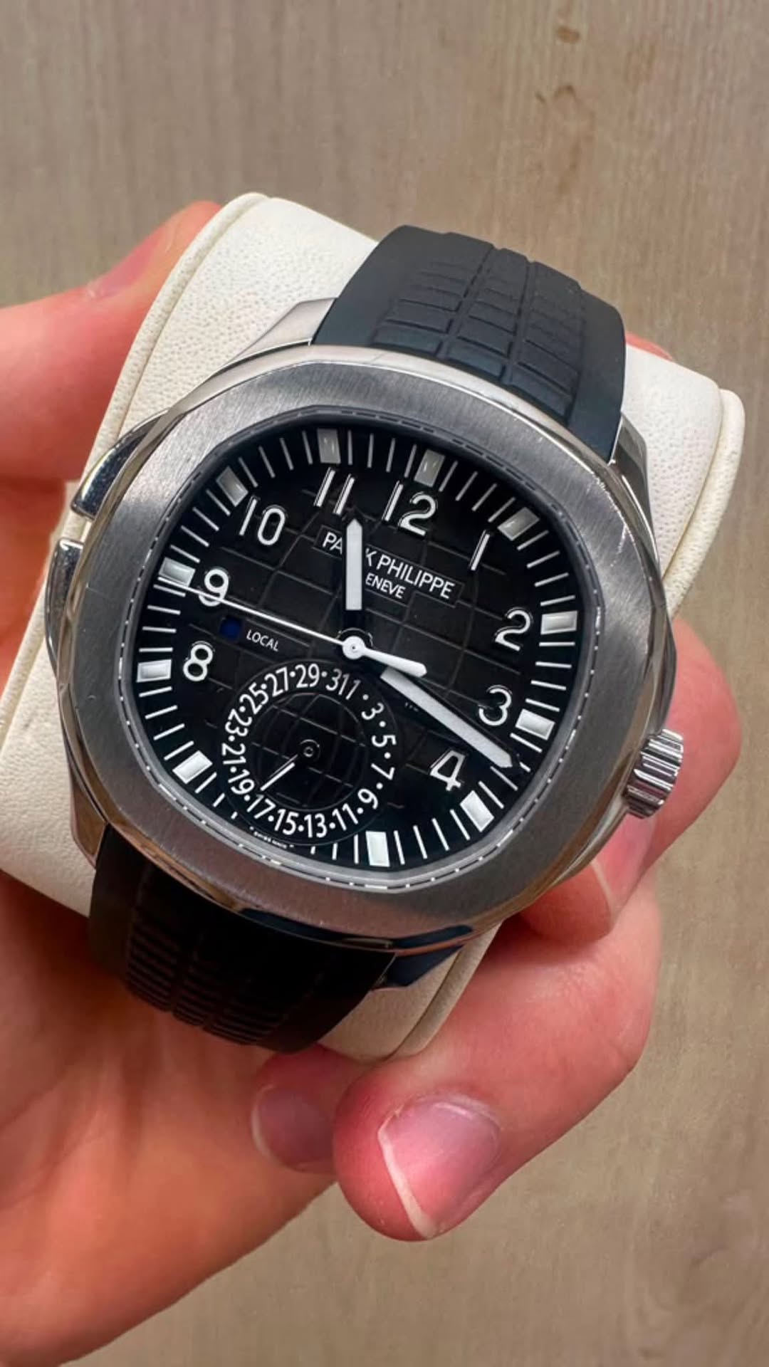 May be an image of wrist watch and text