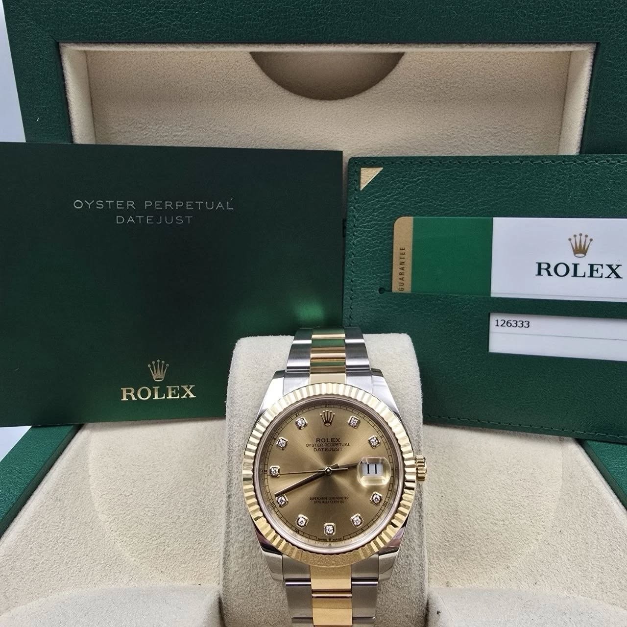 May be an image of wrist watch and text that says 'OYSTERPER UARANTEL ROLEX 126333 ROLEX क्मा 福 原 金 လည် TLMA 2 D ሸ C 6 G ® fo 0'