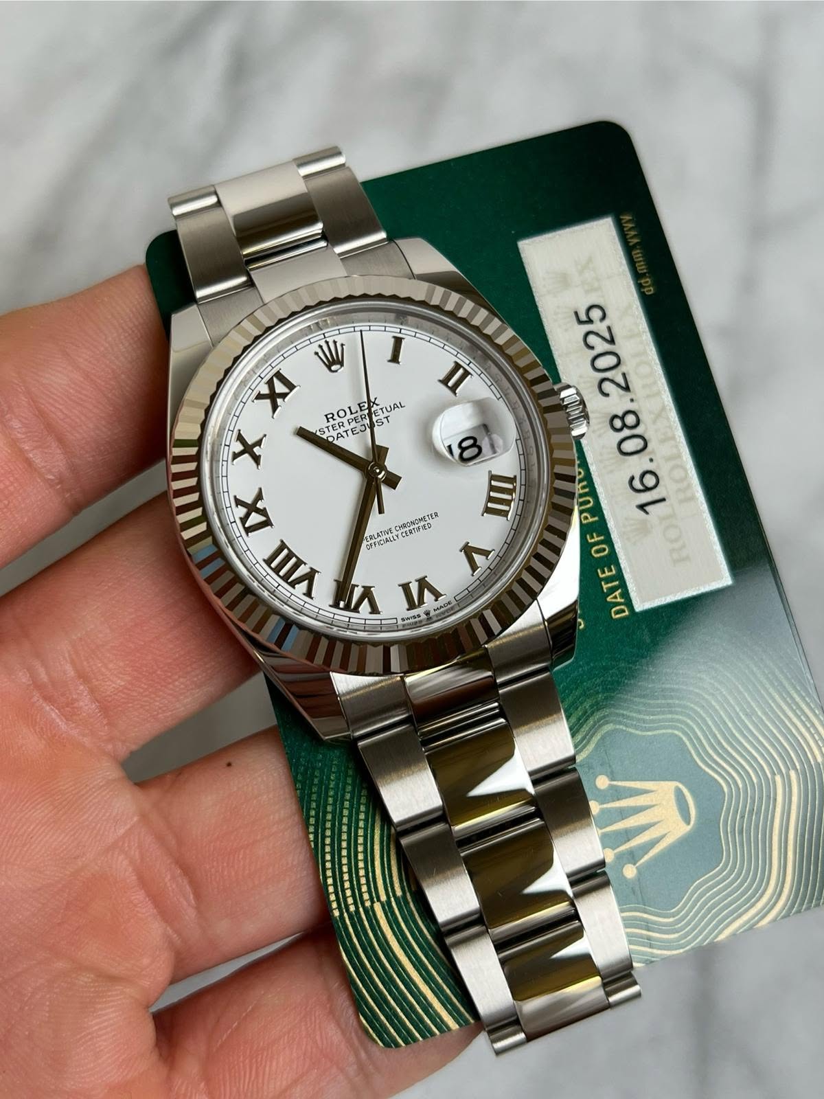 May be an image of wrist watch and text