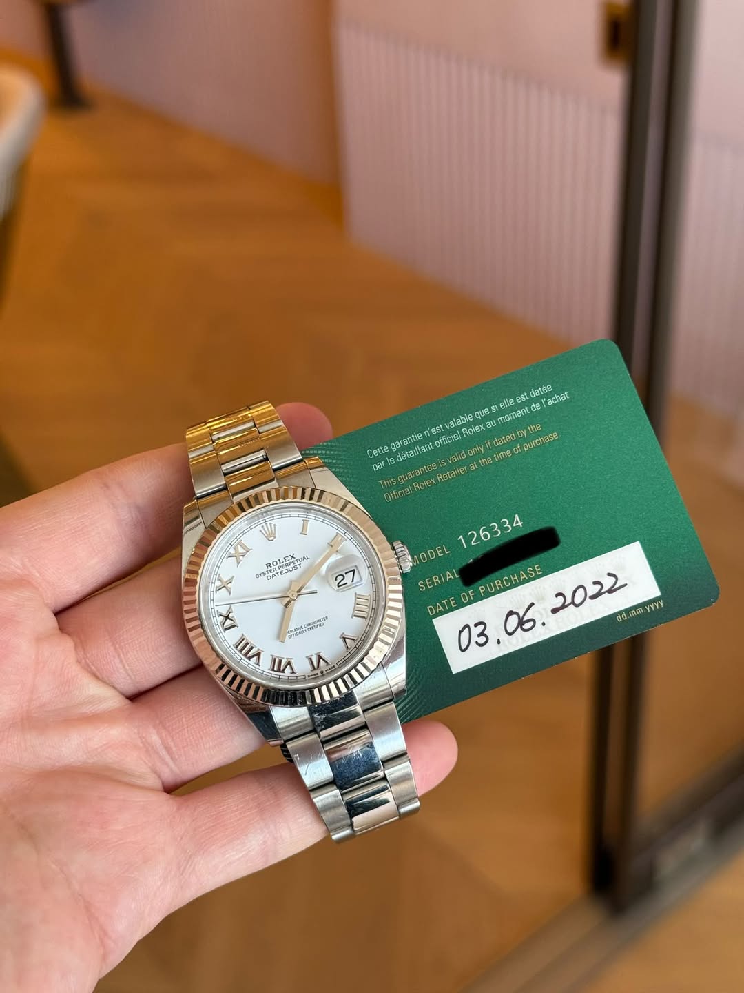 May be an image of wrist watch and text