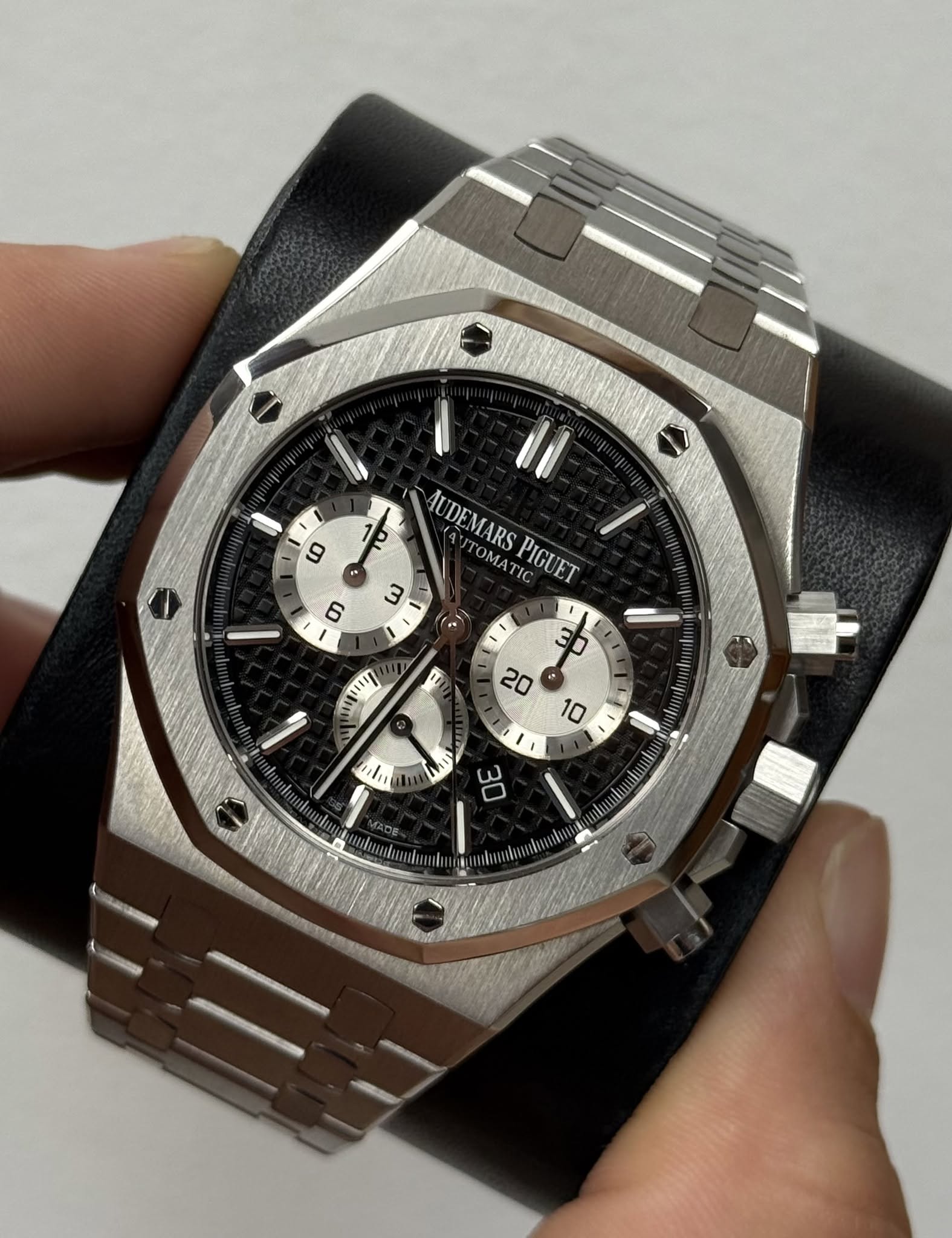 May be an image of wrist watch and text