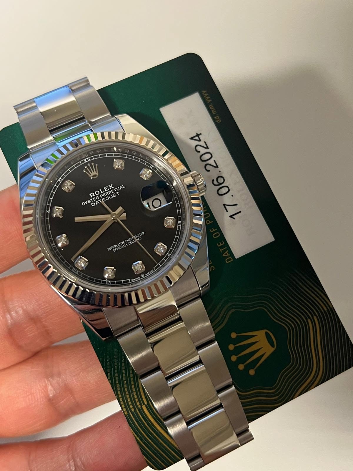 May be an image of wrist watch and text