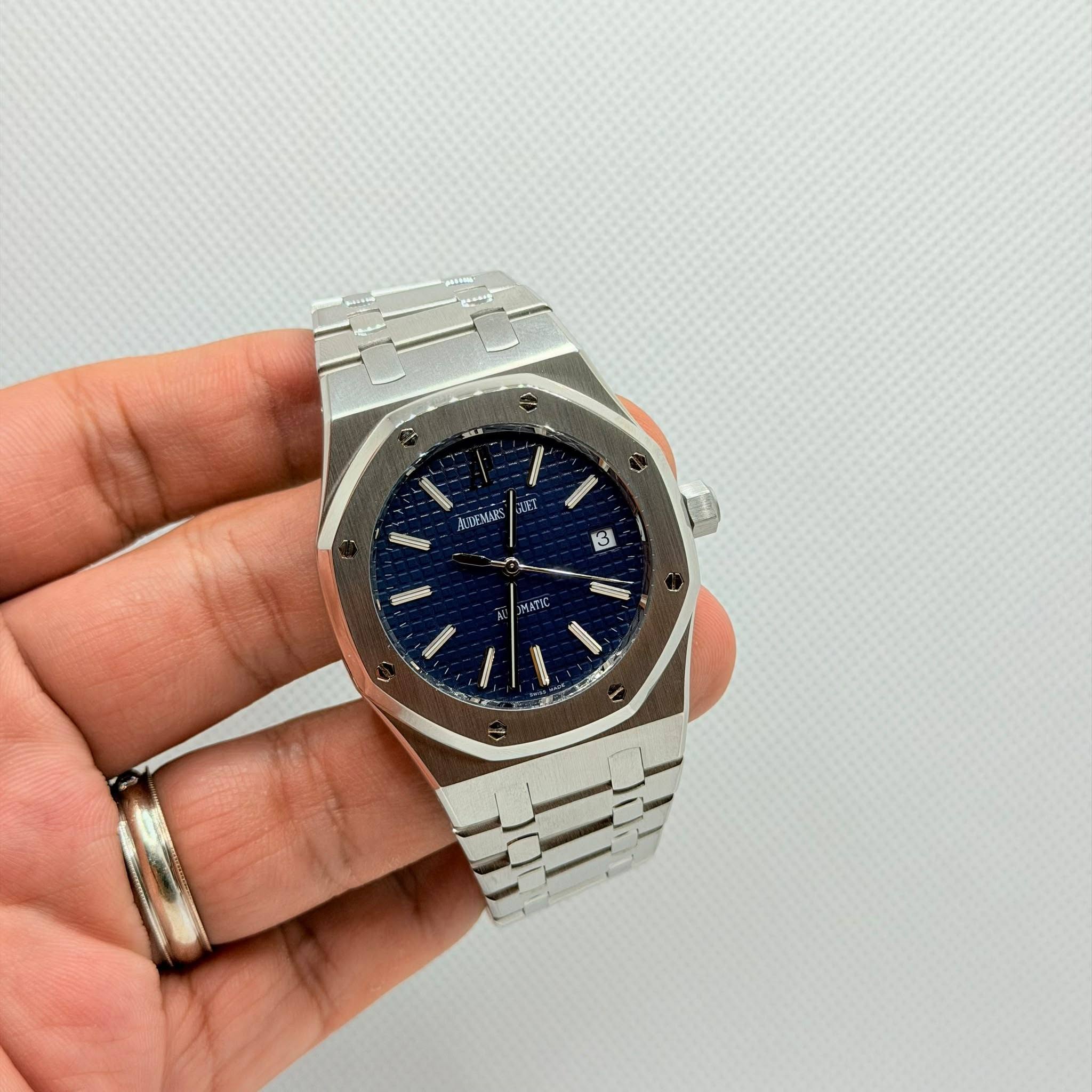 May be an image of wrist watch and text