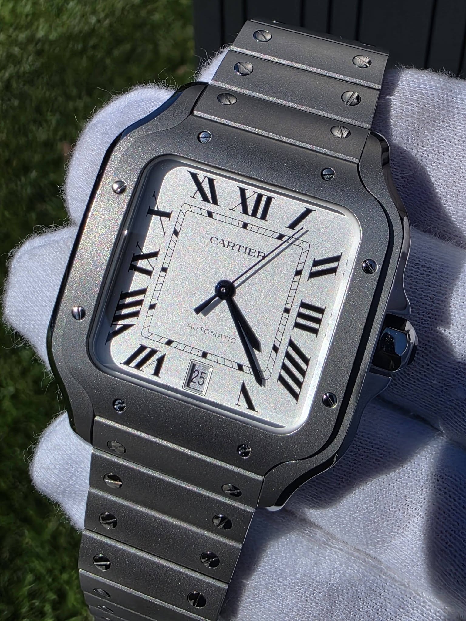 May be an image of wrist watch and text