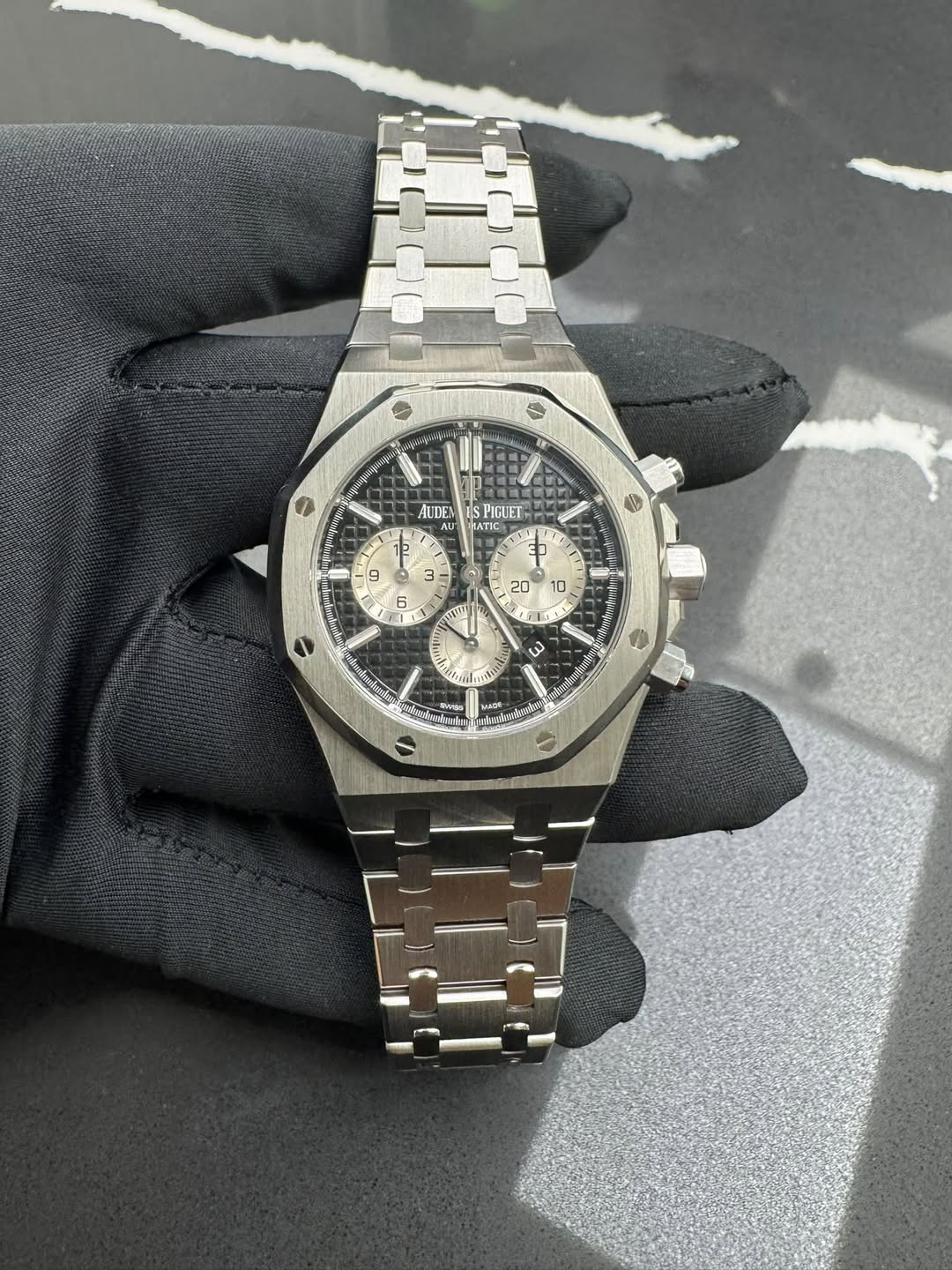 May be an image of wrist watch and text