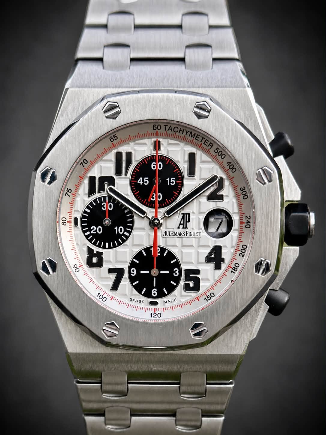 May be an image of wrist watch and text
