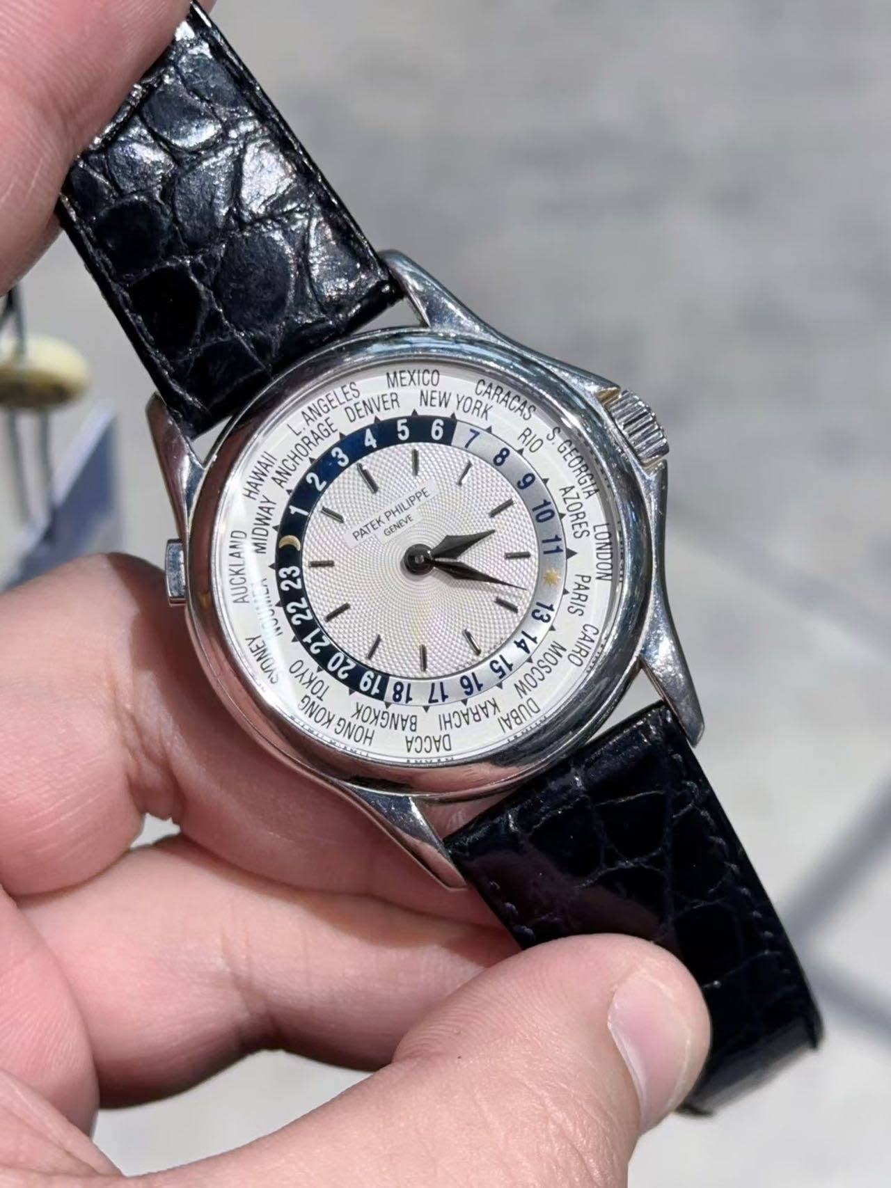 May be an image of wrist watch and text