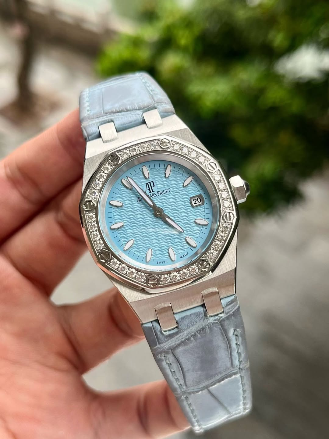 May be an image of wrist watch and text