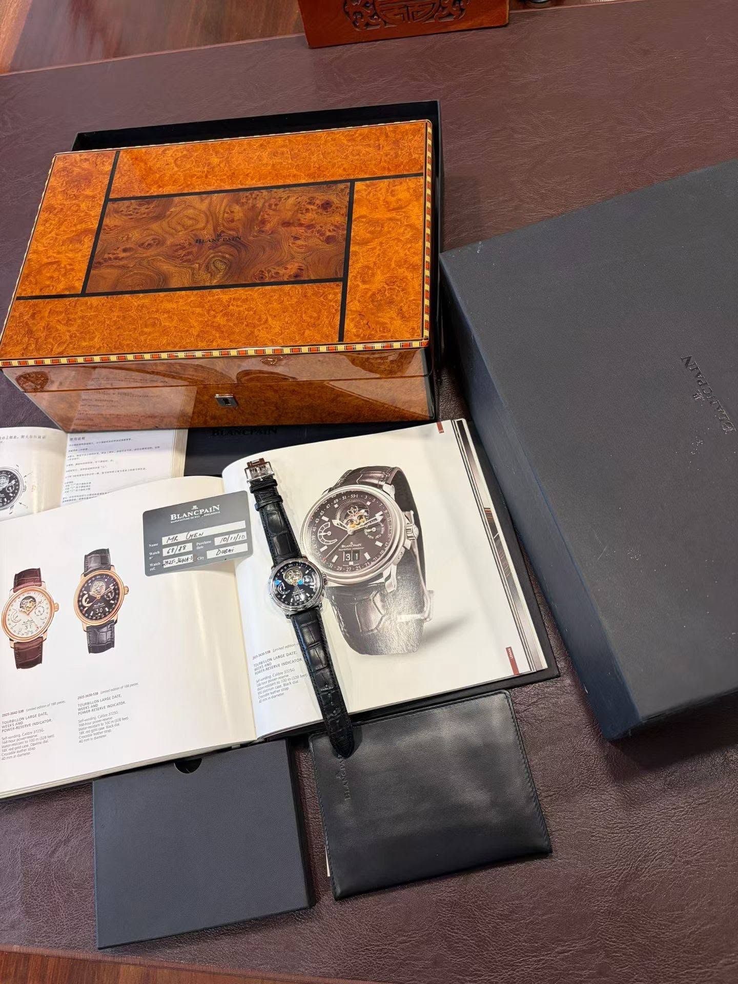 May be an image of diary, leather, wrist watch, saddle-stitched leather, leather wallet, book and text