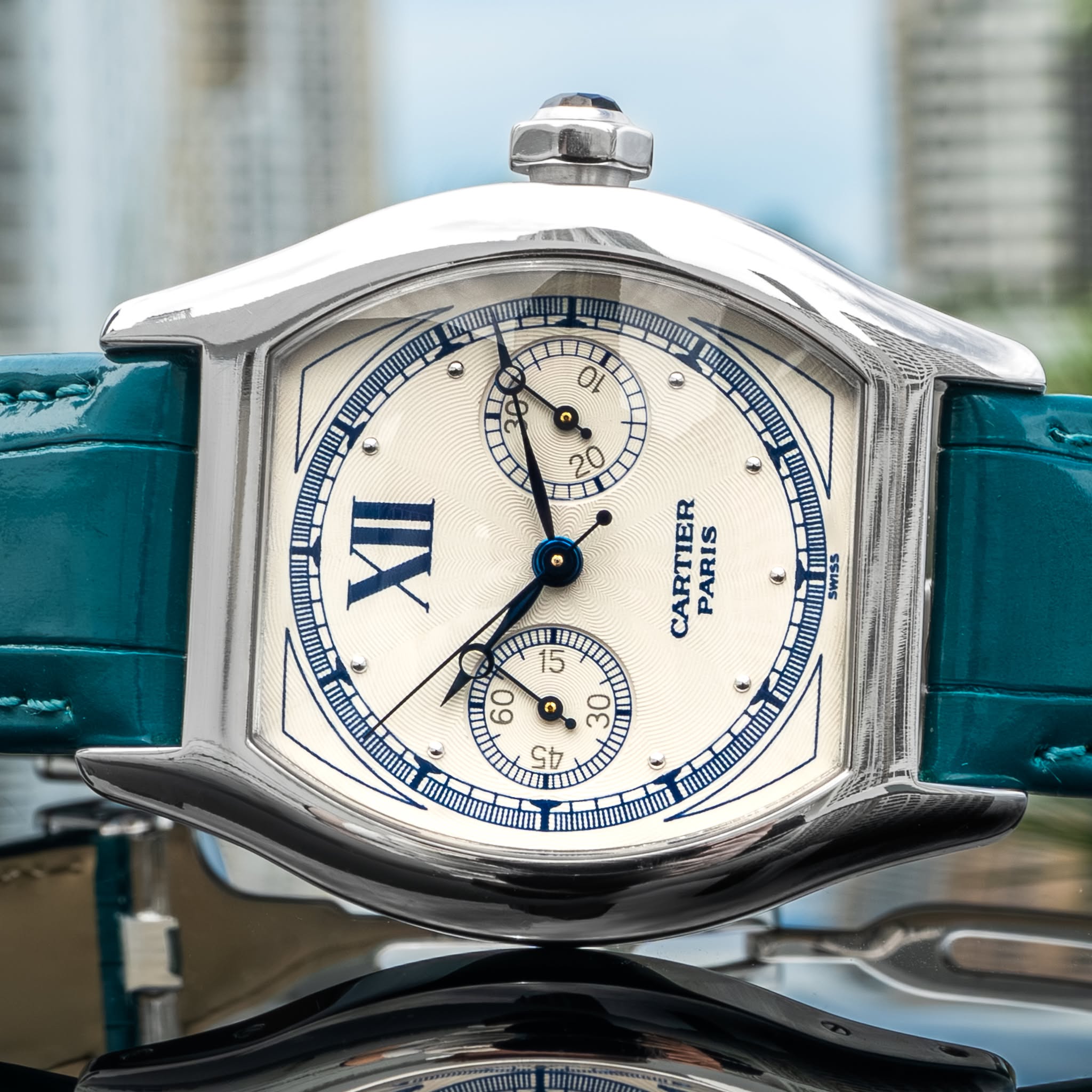 May be an image of wrist watch and text
