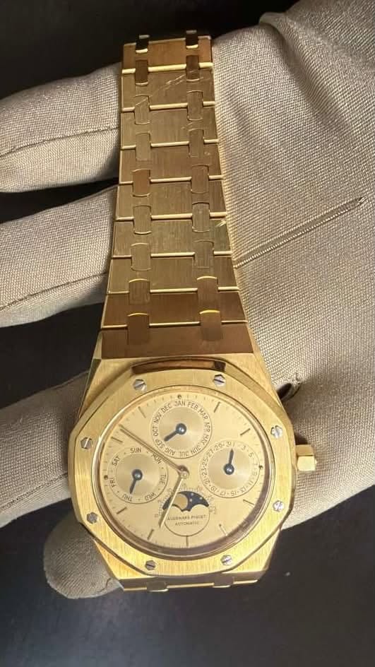 May be an image of wrist watch and text